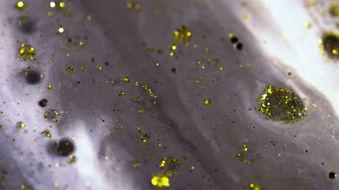 Macro close up of Golden Wet Glitter Particles of acrylic paint and oil. Stock Footage 150575772