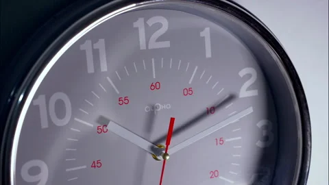Macro Close-Up of a Gray Clock With Red Second Hand 動画素材 337393014
