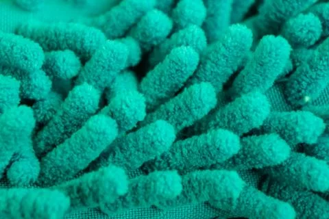 Macro close up of green chenille microfiber texture for cleaning, trapping du Stock Photos