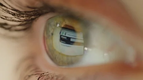 MACRO CLOSE UP: Green eyed woman using Amazon webpage for her online shopping Stock Footage