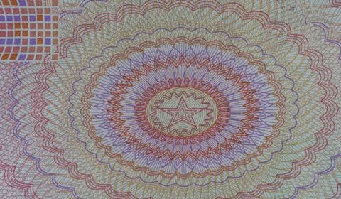 Macro close up of guilloche security pattern with star element on Chinese y.. Stock Photos