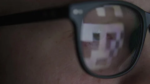 Macro Close-up of Hacker with Code Reflected in Glasses in Dark Room Stock Footage 208797709