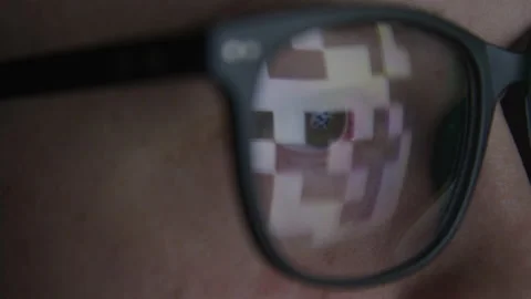 Macro Close up of Hacker Watching Code Reflected in Glasses in Dark Room Stock Footage 208797922