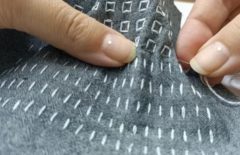 Macro Close Up of Hand Stitching on Dark Fabric – White Geometric Embroidery Stock Photos