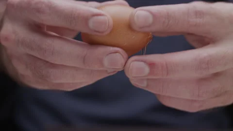 Macro close up of hands breaking an egg Stock Footage 274280671