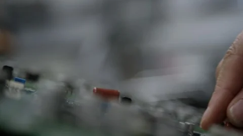 Macro close up of hands building circuit board Stock Footage 92716220