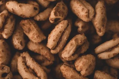 Macro close up of inflated wheat cereal, selective focus Stock Photos