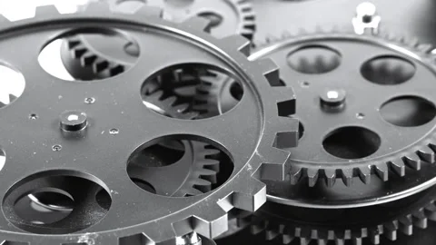 Macro Close-Up of Interlocking Dark Metal Gear System Stock Footage 341611258