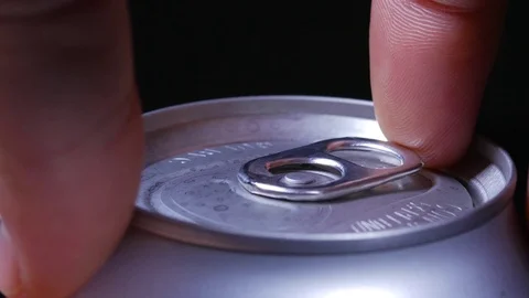 Macro close up of lid as hand opens a canned drink using tab Stock-Footage 70243475