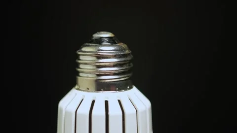 Macro close up of light bulb socket base. Screw base of the bulb rotation w.. Stock Footage 271096763