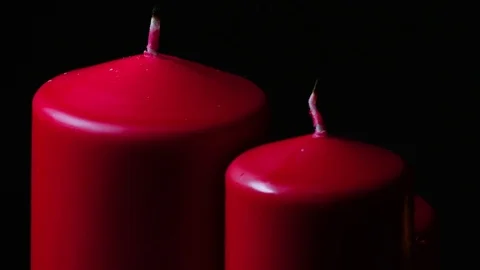 Macro close up lighting 1 of 3 candles rotating around Stock Footage 70240302