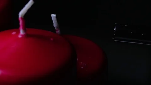 Macro close up lighting a candle rotating around black background Vídeo Stock 70244792