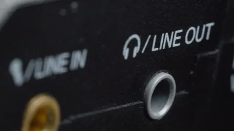 Macro close up of line out audio jack connector on electronic device Stock Footage 340192755