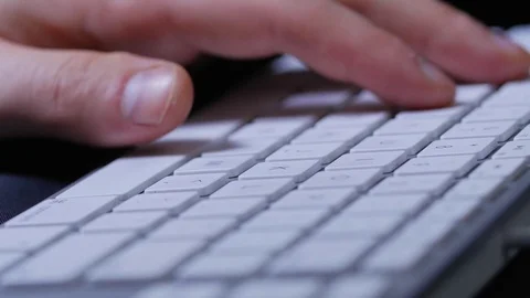 Macro close up of male hands typing on keyboard with white buttons 스톡 동영상 70243967