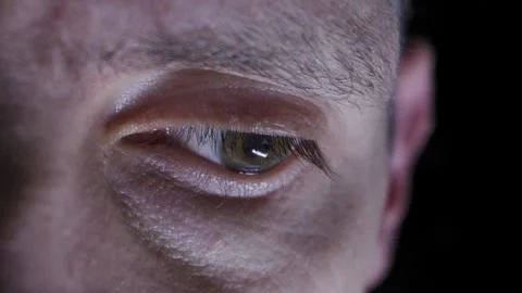 Macro Close Up Of A Mans Eye Looking Around Nervously In The Dark Vidéo 329834546