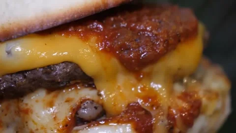 Macro Close-Up of a Melty Gourmet Double Cheeseburger Stock-Footage 347687826