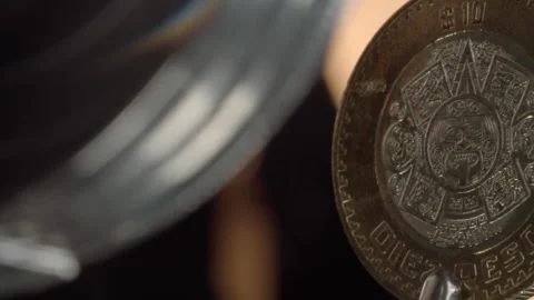 Macro Close Up of Mexican Coin with Intricate Engraving and Decorative Emblem Stock Footage 345101169