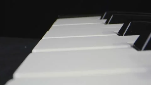 Macro close-up moving through piano keys 動画素材 130595900
