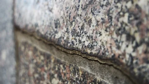 Macro close up of a natural stone texture with a deep crack in the surface, as t Stock Footage 341985583