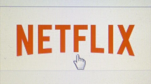 Macro close up of Netflix logo on white home page with cursor pointing Stock Footage 104276245