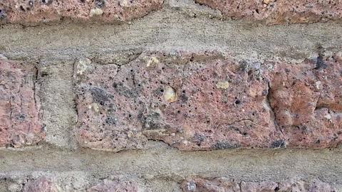 Macro close-up of old porous red brick wall texture with rough mortar Stock Footage 341901107