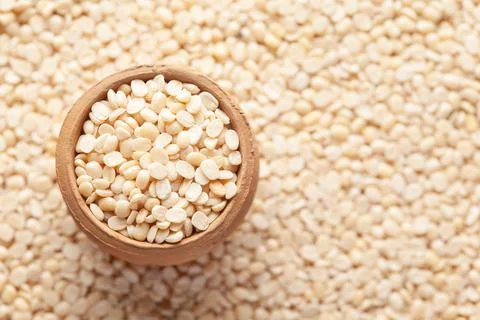 Macro Close up of Organic split polished white urad dal (Vigna mungo)  in an  Stock Photos