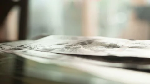 Macro close up. Paper bills American 100 dollars fall on glass table opposite 库存影片 150449370