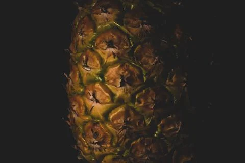 Macro close up portrait of a Pineapple, black background Stock Photos