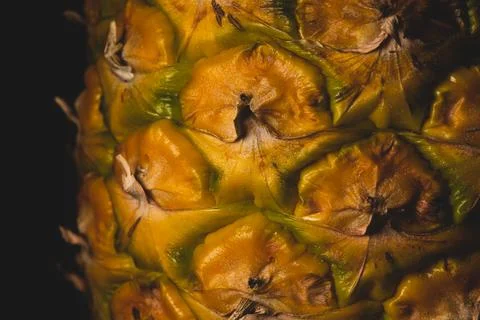 Macro close up portrait of a Pineapple, black background Stock Photos