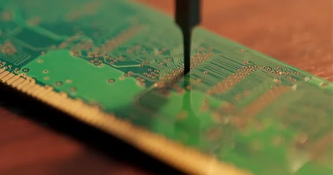 Macro Close-Up of Precision Tool on a Circuit Board in Electronics Workshop 動画素材 336459949