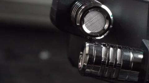 Macro close up of professional microphone grille and metal mesh audio equipment Stock Footage 340812339