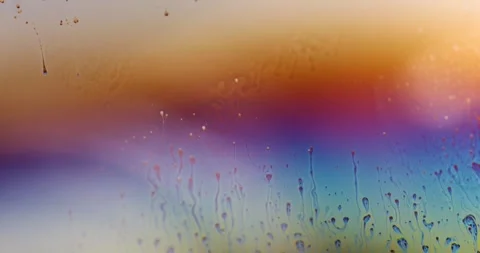 Macro Close Up of Psychedelic Rainbow Swirling Patterns on Soap Sheen Surface Stock Footage 346168555
