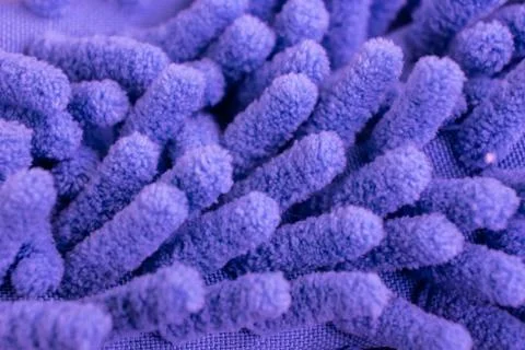 Macro close up of purple chenille microfiber texture for cleaning, trapping d Stock Photos