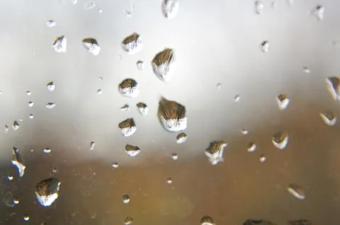 Macro close up of rain drops on the window glass Stock Photos