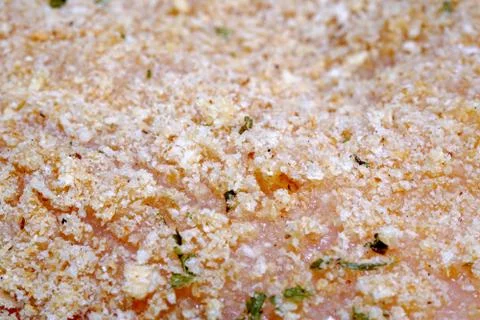 Macro close up raw chicken cutlet breaded with italian bread crumbs Stock Photos