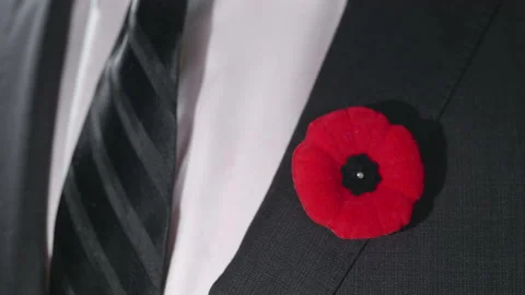 Macro Close Up Red Poppy Lapel Pin on Businessman Suit, Remembrance Day Veteran Stock Footage 149489605