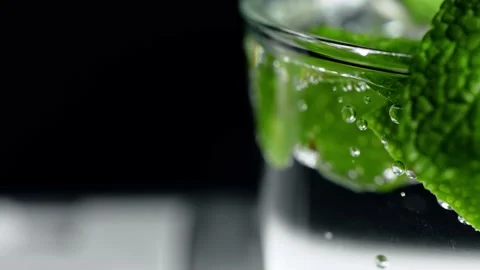 Macro close-up,refreshing soda tonic fizzy water, lime in Glass, ice. Slice of Stock-Footage 148161237