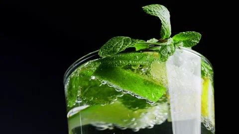 Macro close-up,refreshing soda tonic fizzy water, lime in Glass, ice. Slice of Stock-Footage 148161326