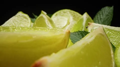 Macro close-up,refreshing soda tonic fizzy water, lime in Glass, ice. Slice of Stock Footage 202012603