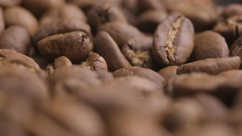 Macro close up, roasted coffee beans spinning shot. Abstract pattern Stock Footage 163486914