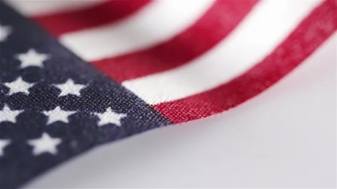 Macro close up from rotating american flag with white background Stock Footage 131769328