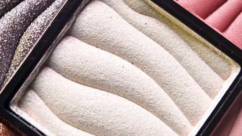 Macro Close-Up of Rotating Textured White Eye Shadow Stock Footage 256156748