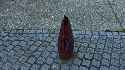Macro Close Up of Rusted WW2 Artillery Shell Used as Bollard in Normandy Stockbeeldmateriaal 333634547