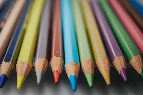 Macro close-up of sharpened colored pencils arranged side by side. Stock Photos