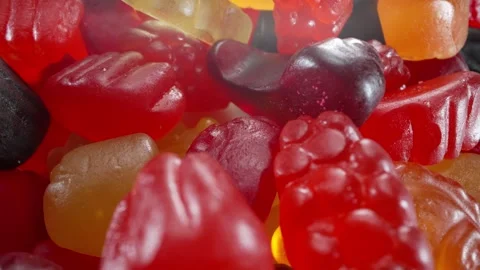 Macro Close-up Shoot of Rotated Multi-colored Jelly Candies Stock Footage 252970036