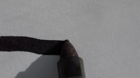 Macro close up shot of a black sharpie permanent marker drawing a straight Stock Footage 251522015