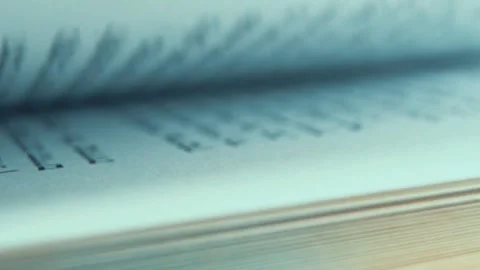 A macro close up shot of fast rolling pages of a book, Hebrew font script, Stock Footage 244856854