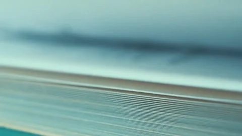 A macro close up shot of fast rolling pages of a book, Hebrew blurred Stock Footage 244857886
