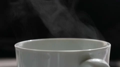 Macro close up shot of hot coffee, tea. Smoke of drink, caffeine. breakfast c Stock Footage 178350648