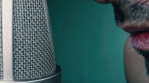 Macro close-up shot of man singing in microphone Stock Footage 131058683